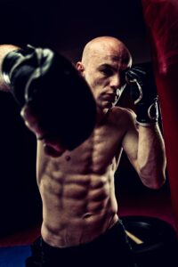 <img src="man training on a punching bag.jpg" alt="how to train on a heavy bag"/>