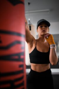 <img src="girl punching bag.jpg" alt="how to train on a heavy bag"/>